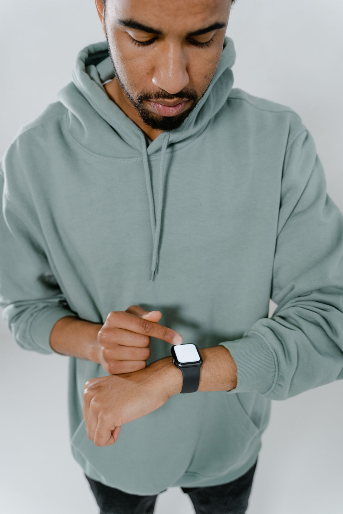 Man wearing smartwatch checking Bluetooth notifications